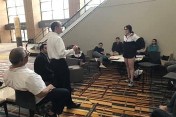 Judge John Madden offering feedback to Erin McCoy as students enter National Mock Trial competition today
