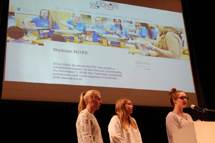 From left: Gretchen Carpenter, Emily Dawson, Aly Gallagher launch Hope 25 at an Upper School Town Hall on September 26.