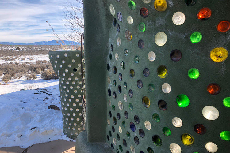 Exterior wall, recycled glass bottles. Photo by Adam Meltzer