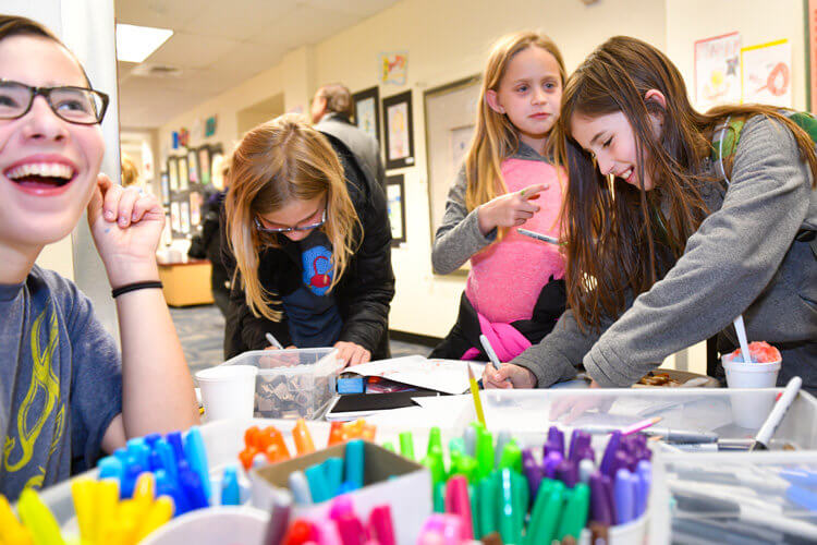 Middle School students helped with art-making stations around the All-School Arts Festival.