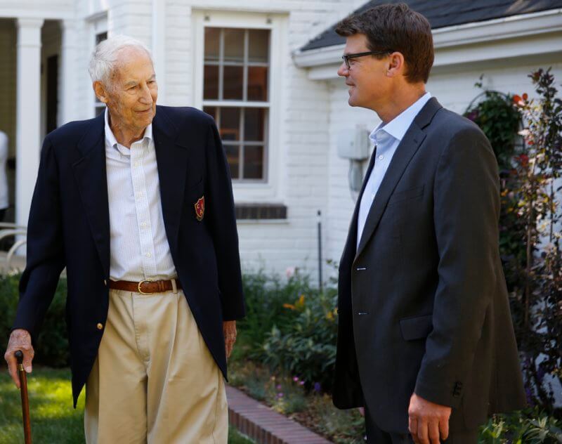 Chuck Froelicher, left, Colorado Academy's former Headmaster and founder of Outward Bound, speaks with current CA Head of School Mike Davis in 2014.