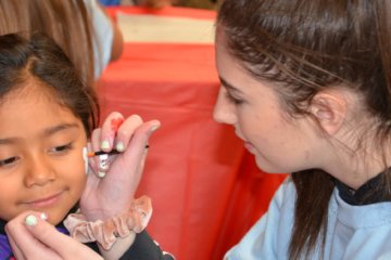 A child gets her face painted during the 2019 HOPE event.