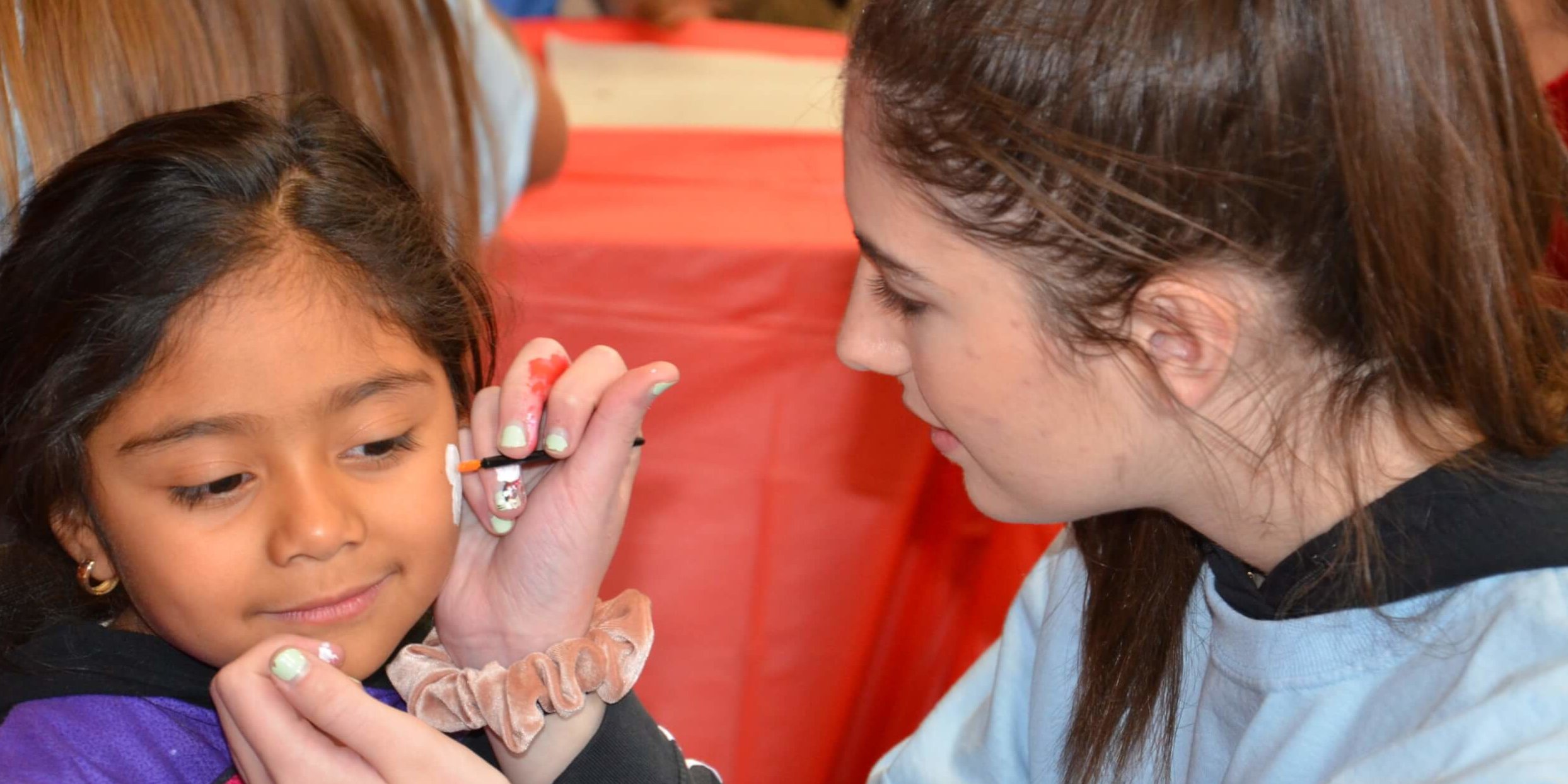 A child gets her face painted during the 2019 HOPE event.